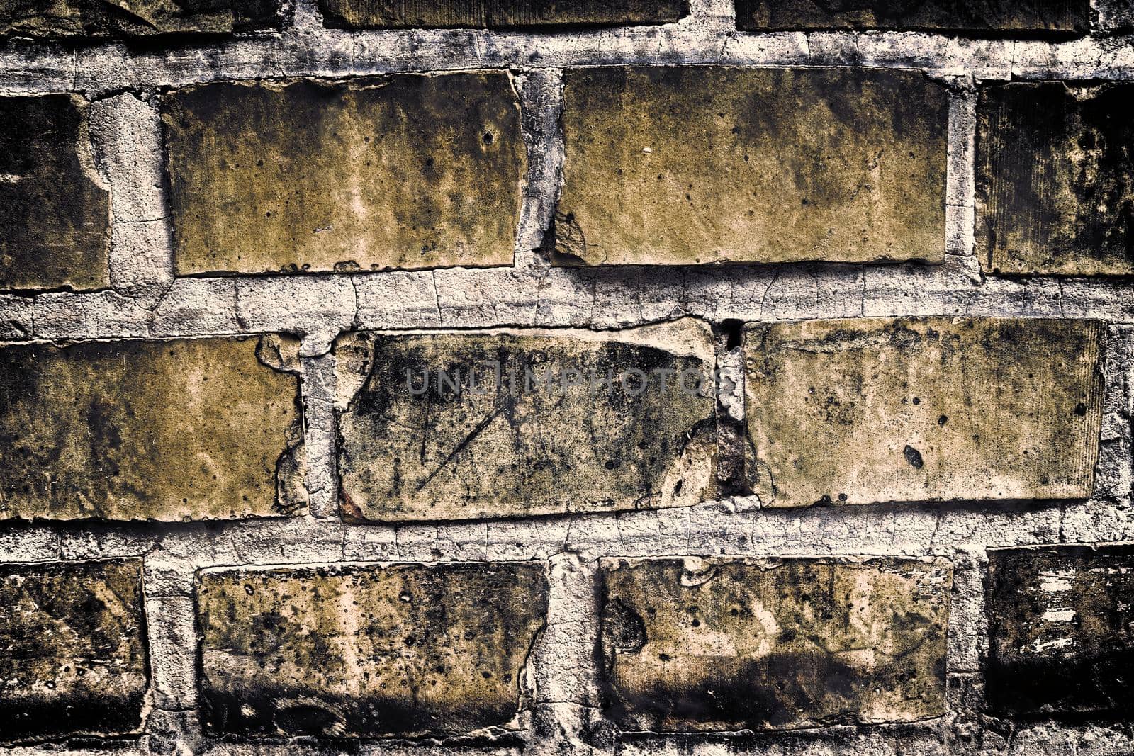 Aged and weathered old brick wall texture in a retro vintage design  by MP_foto71