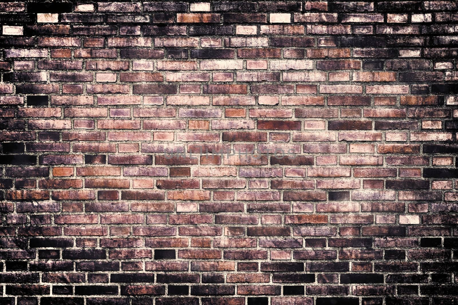 Aged and weathered old brick wall texture in a vintage retro design 