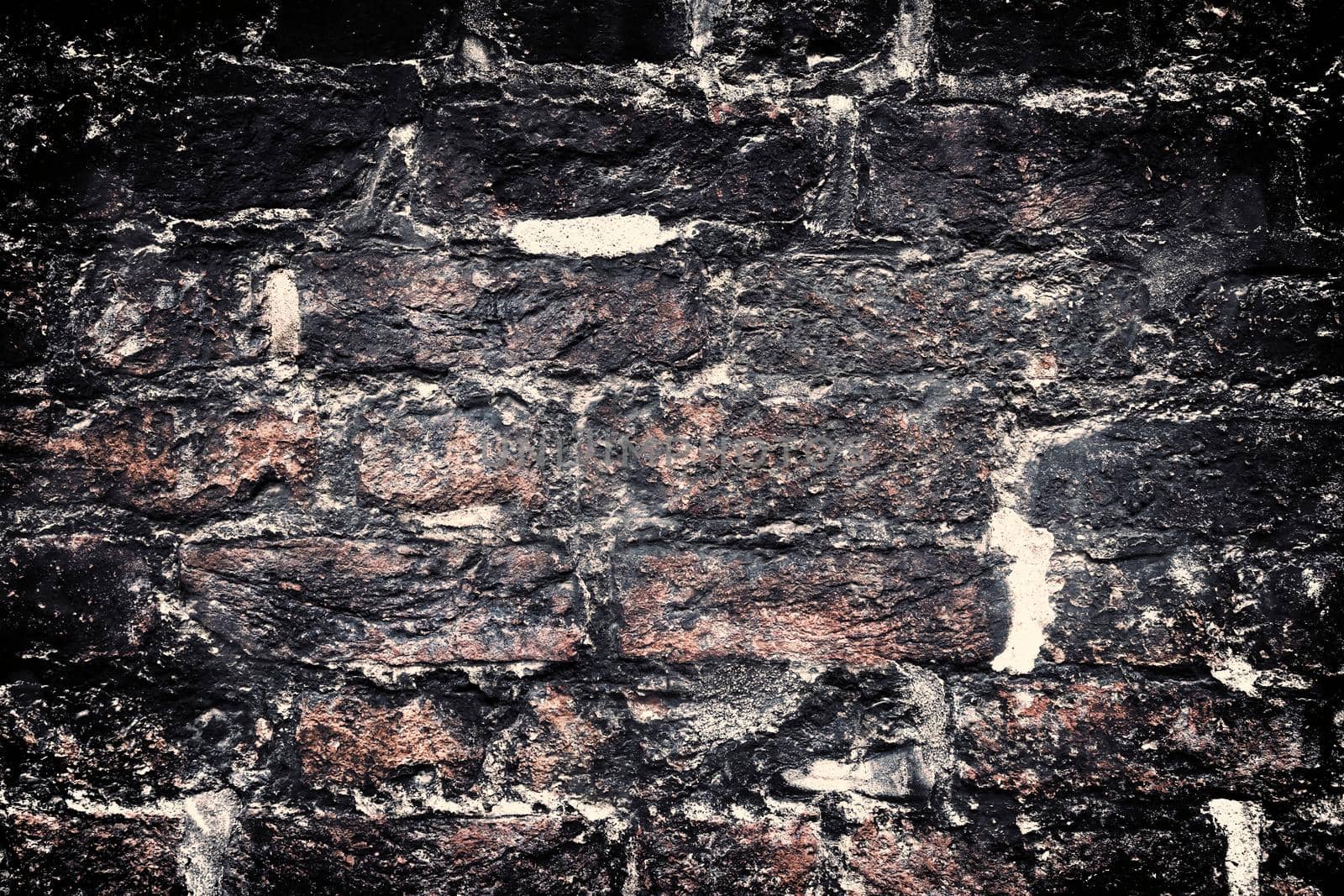 Aged and weathered old brick wall texture in a retro vintage design  by MP_foto71