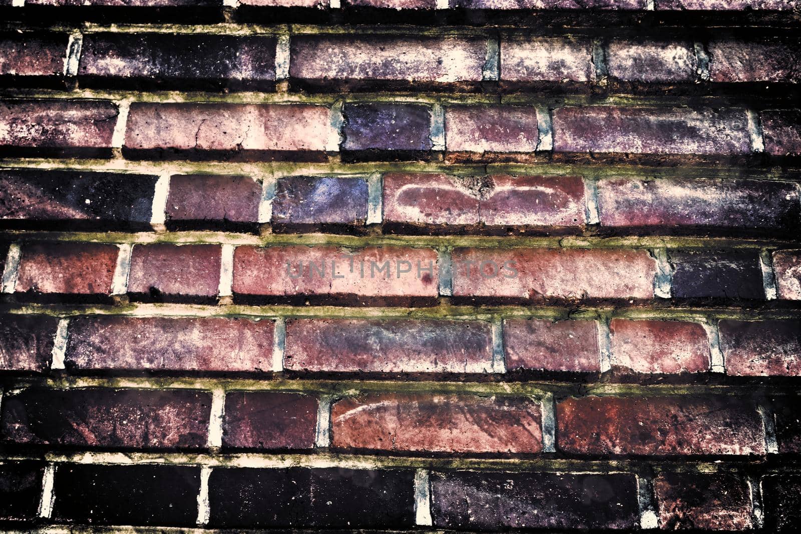 Aged and weathered old brick wall texture in a retro vintage design  by MP_foto71