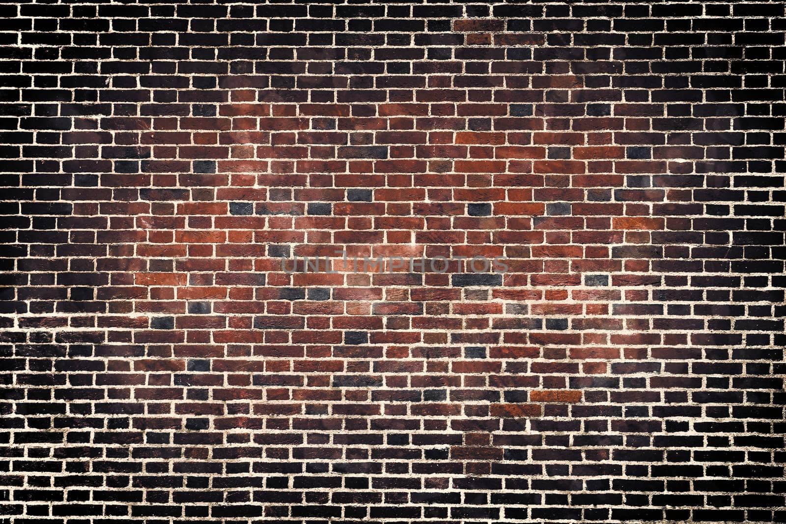 Aged and weathered old brick wall texture in a retro vintage design  by MP_foto71