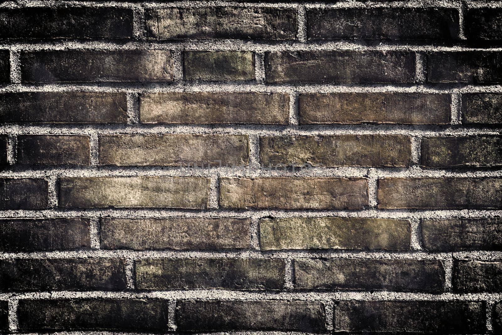 Aged and weathered old brick wall texture in a retro vintage design  by MP_foto71