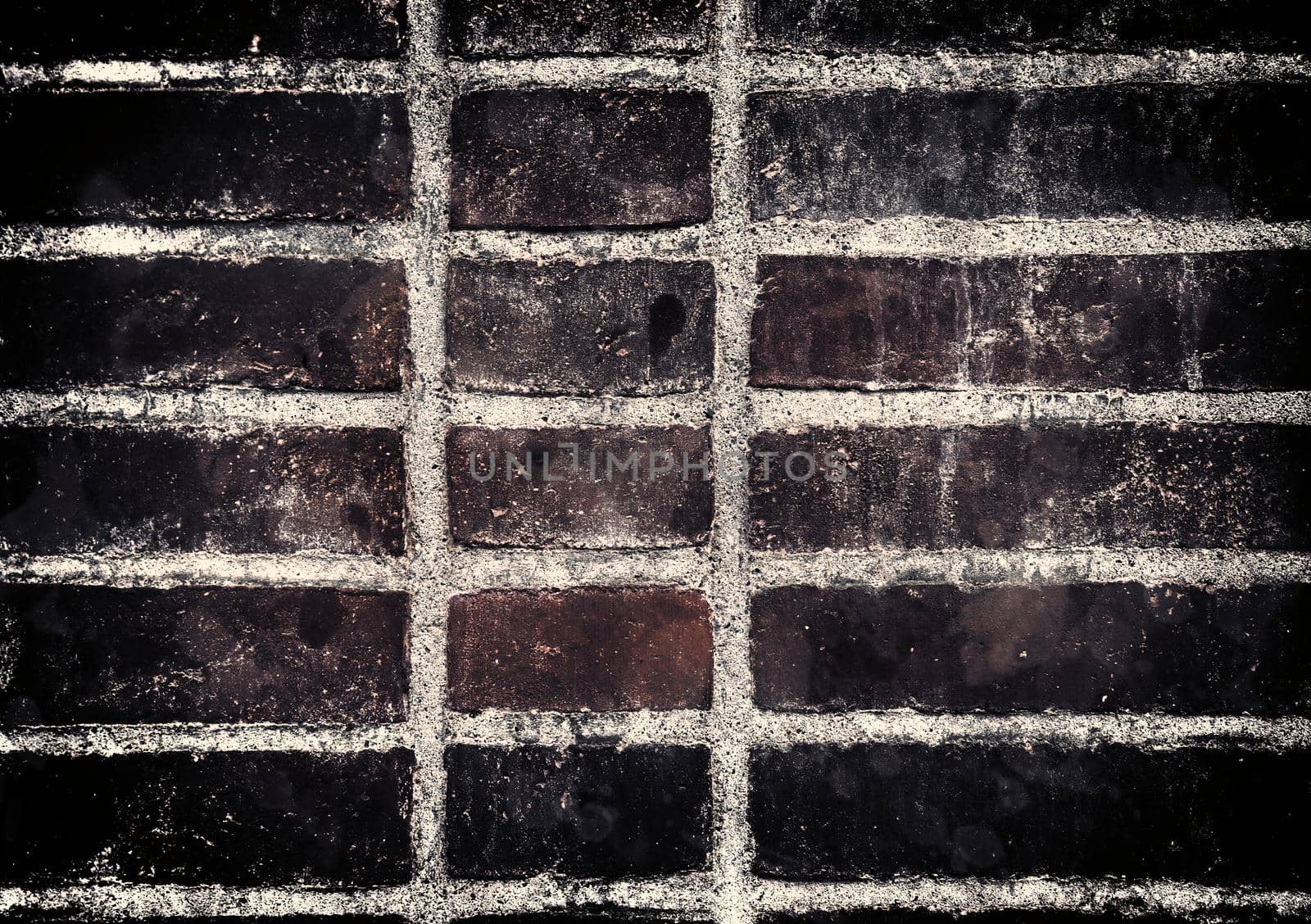 Aged and weathered old brick wall texture in a retro vintage design  by MP_foto71