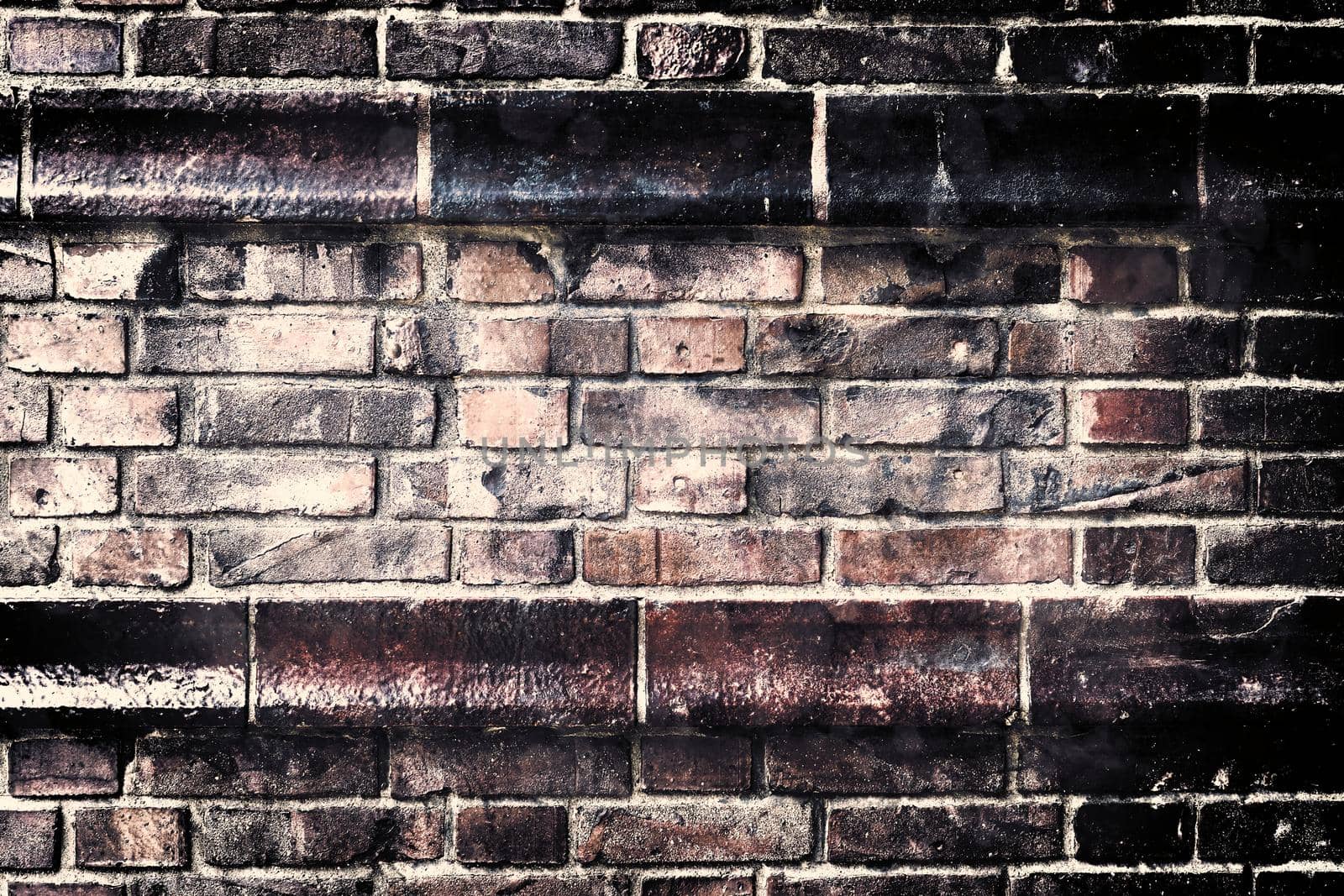 Aged and weathered old brick wall texture in a retro vintage design  by MP_foto71