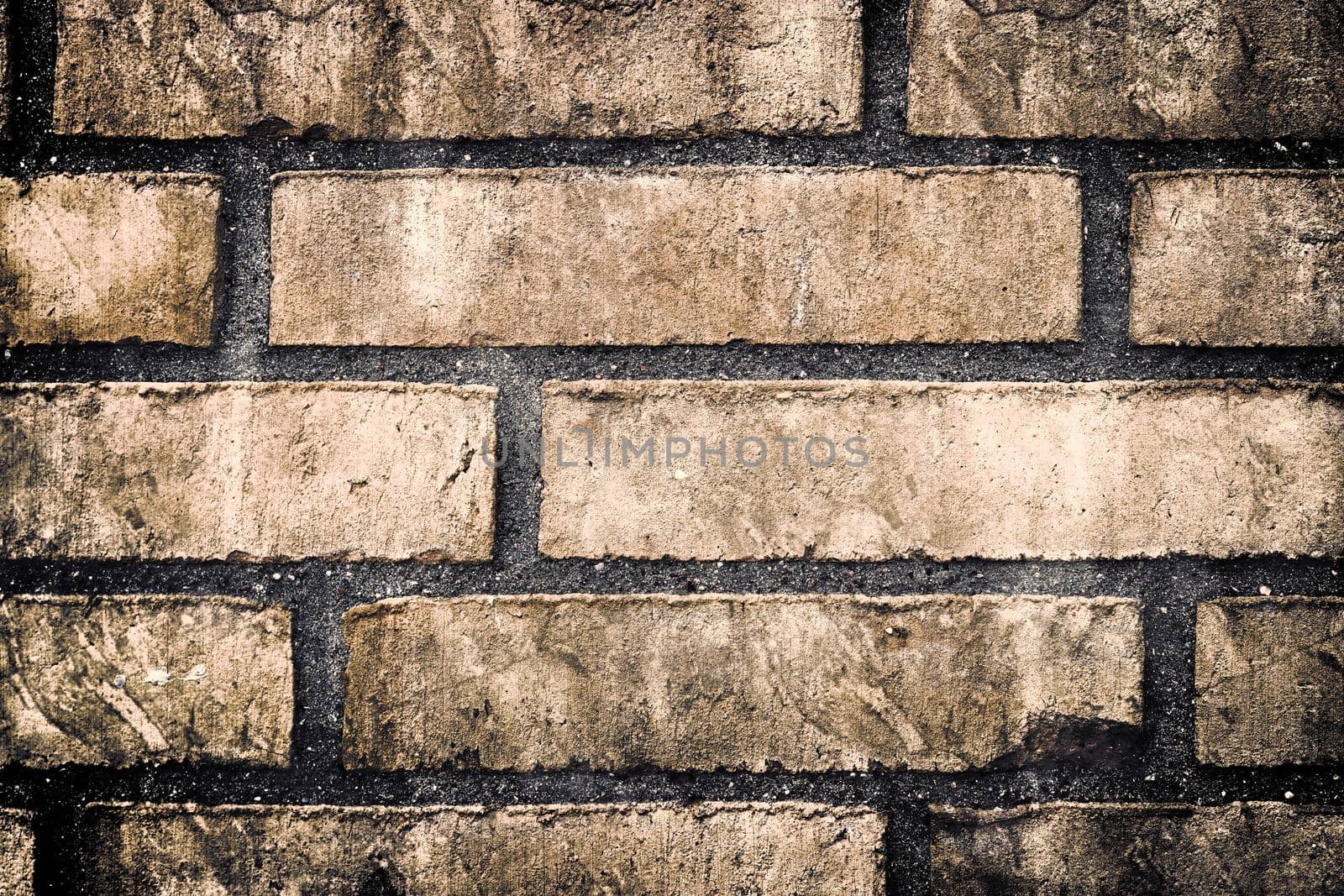 Aged and weathered old brick wall texture in a retro vintage design  by MP_foto71