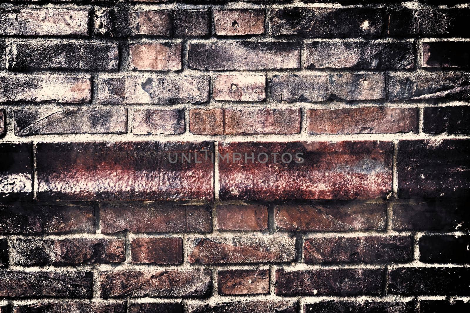 Aged and weathered old brick wall texture in a retro vintage design  by MP_foto71