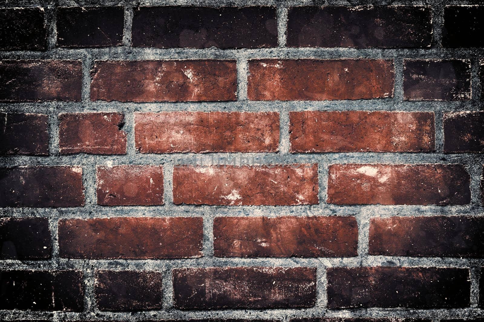 Aged and weathered old brick wall texture in a retro vintage design  by MP_foto71