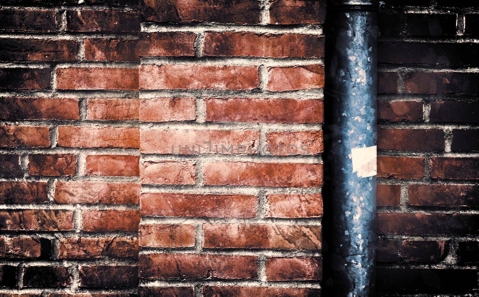 Aged and weathered old brick wall texture in a retro vintage design  by MP_foto71