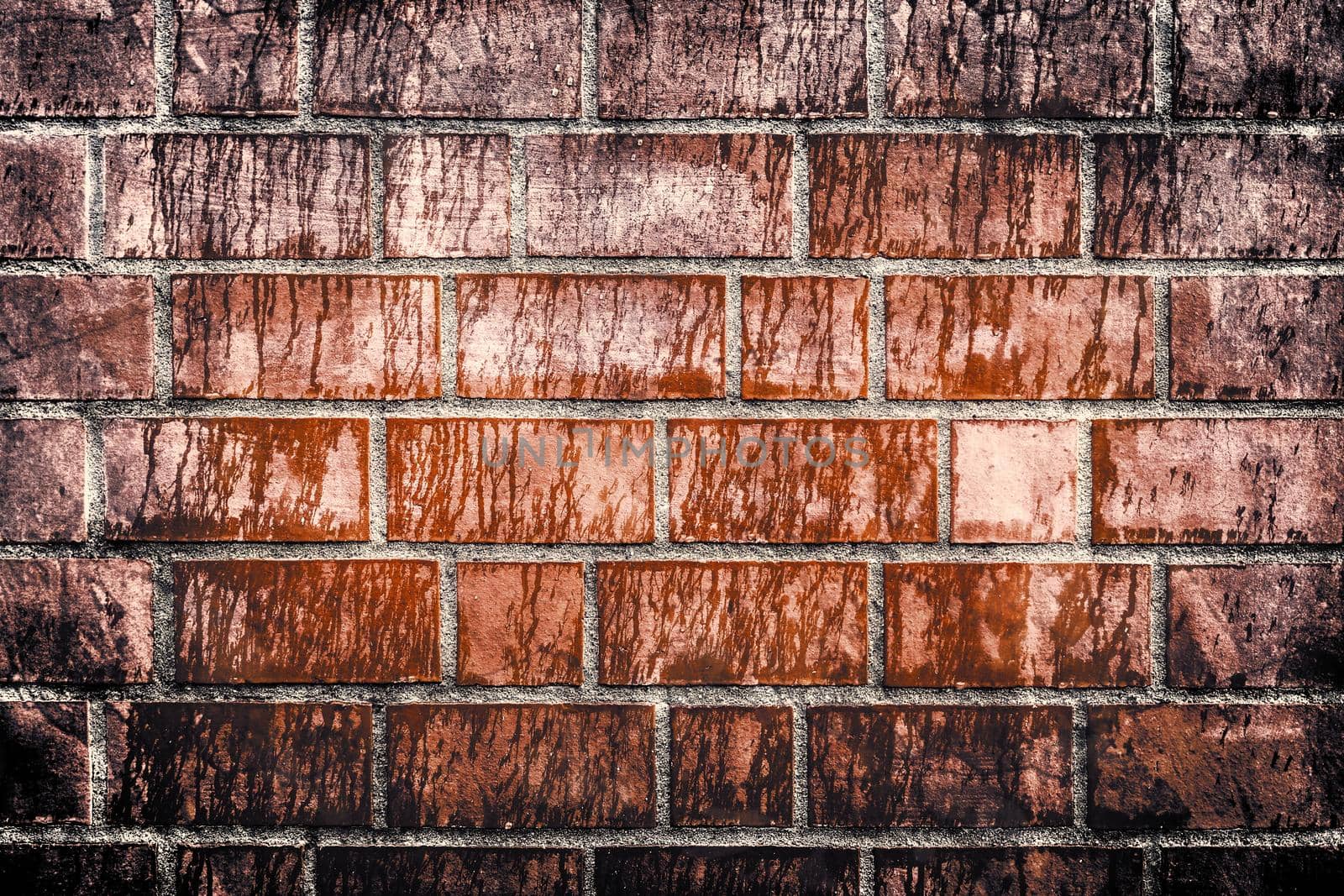 Aged and weathered old brick wall texture in a retro vintage design  by MP_foto71