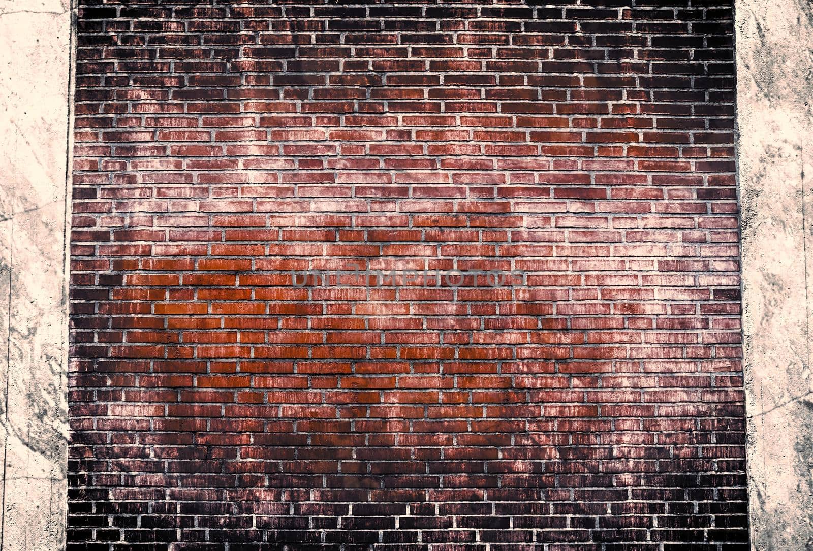 Aged and weathered old brick wall texture in a retro vintage design  by MP_foto71