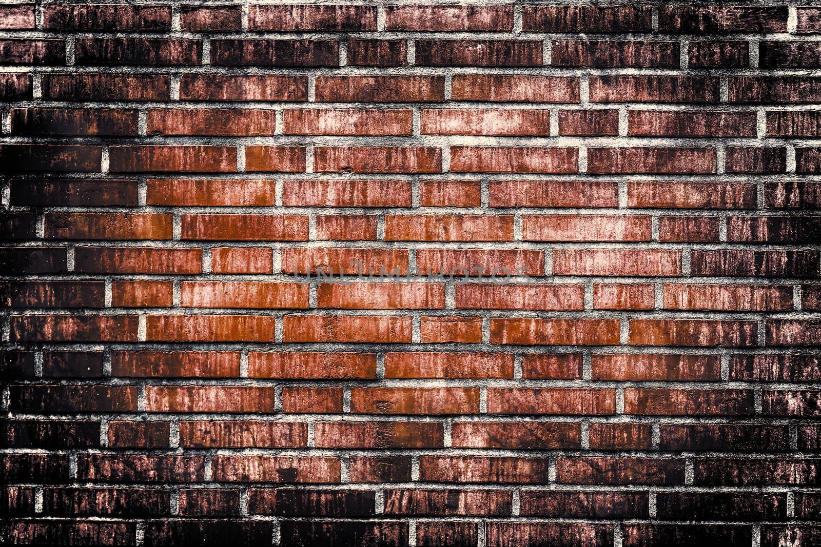 Aged and weathered old brick wall texture in a retro vintage design  by MP_foto71