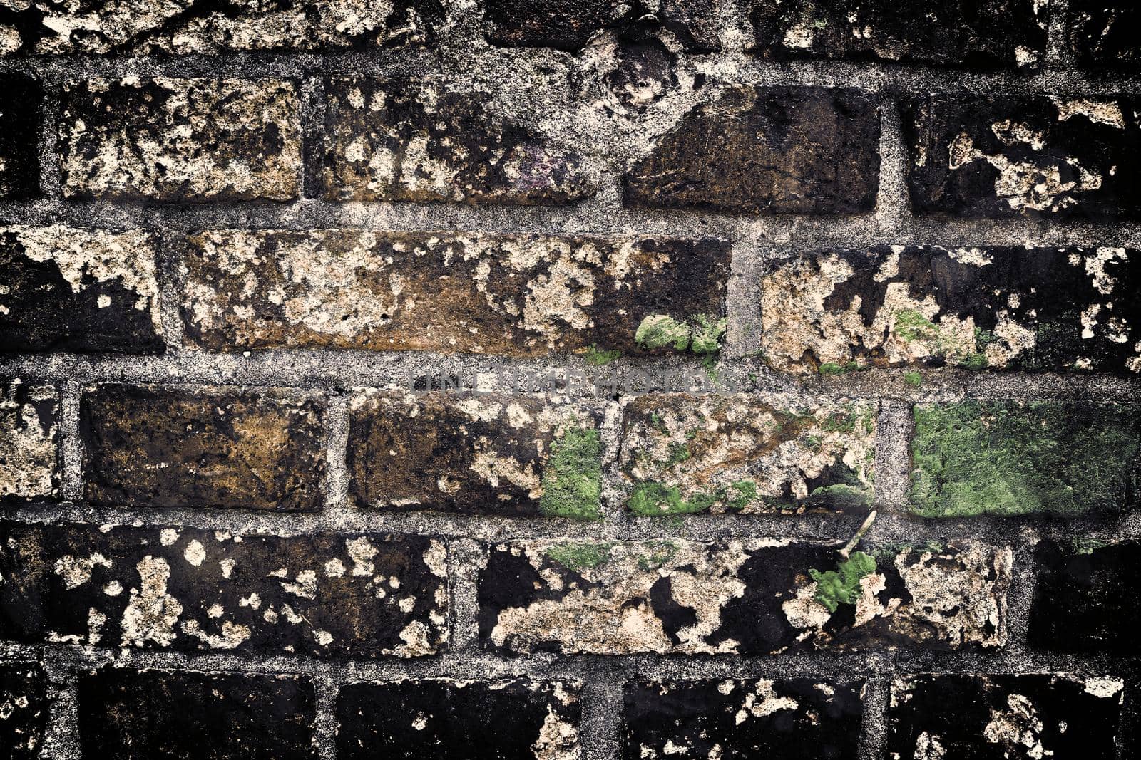 Aged and weathered old brick wall texture in a retro vintage design  by MP_foto71