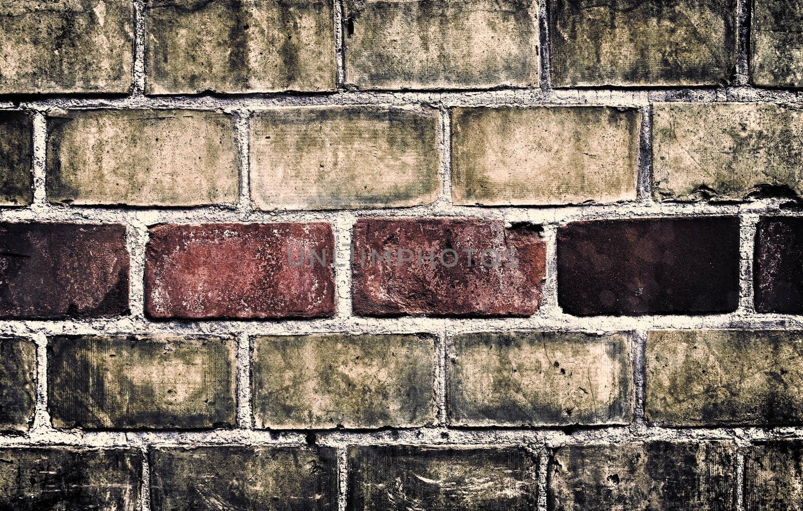 Aged and weathered old brick wall texture in a retro vintage design  by MP_foto71