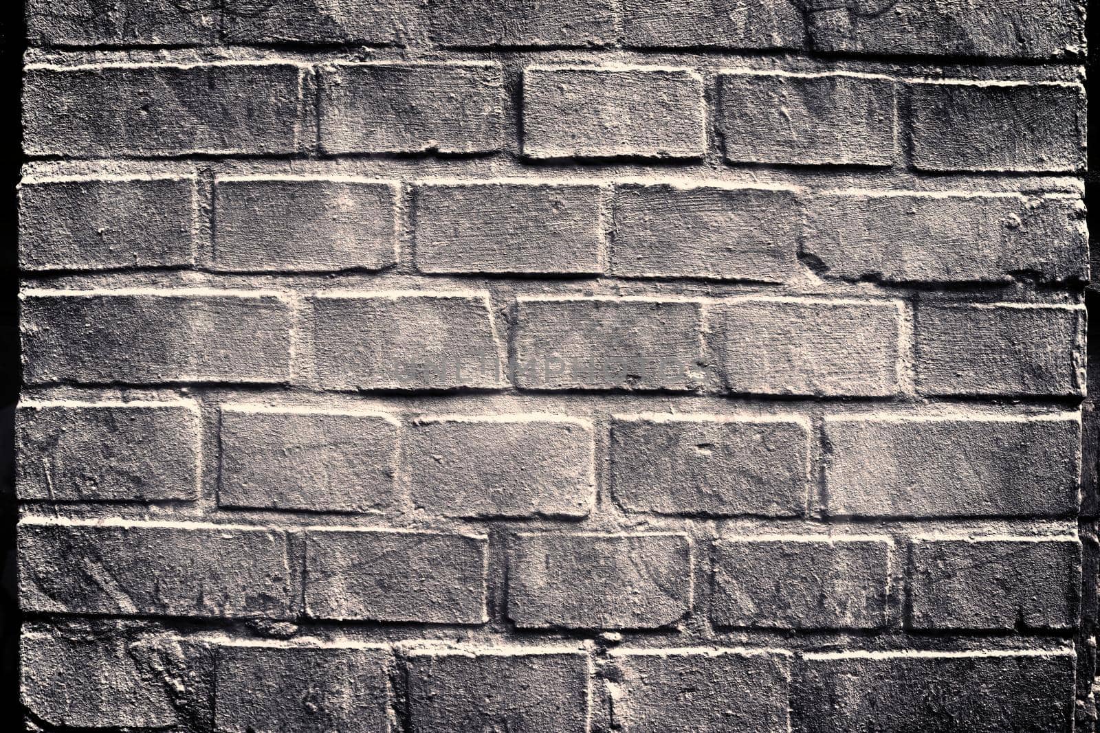 Aged and weathered old brick wall texture in a retro vintage design  by MP_foto71