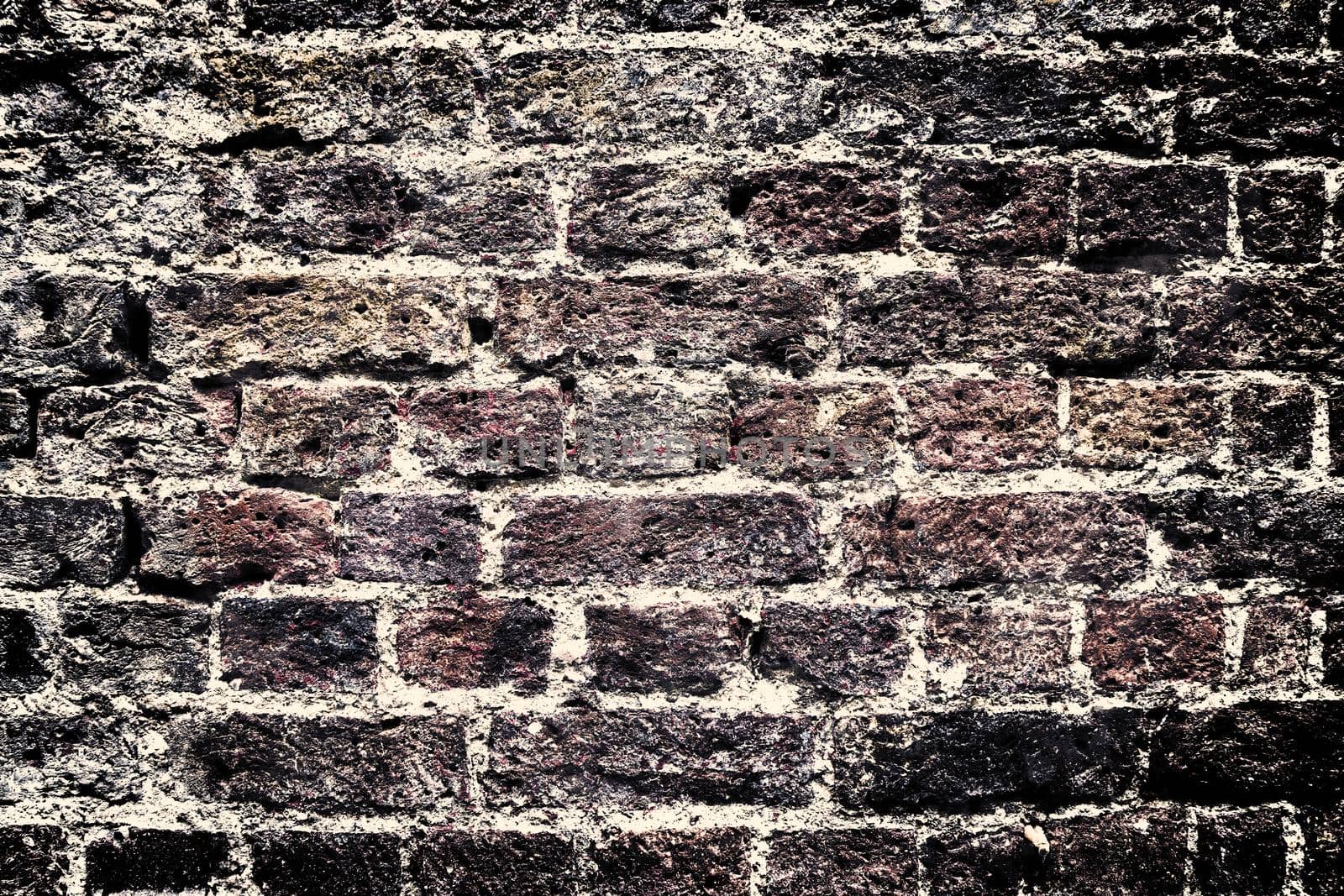 Aged and weathered old brick wall texture in a vintage retro design 