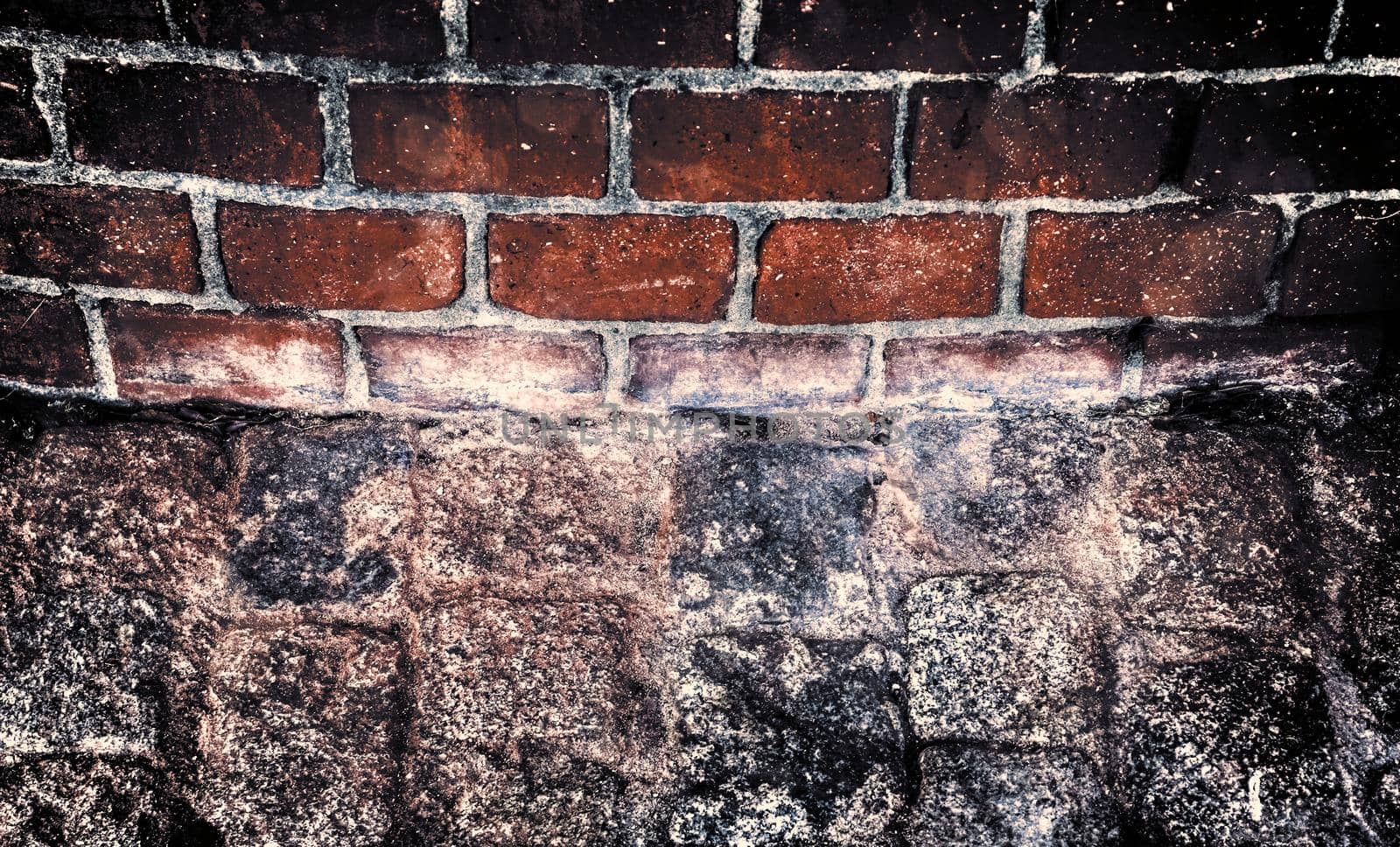 Aged and weathered old brick wall texture in a retro vintage design  by MP_foto71