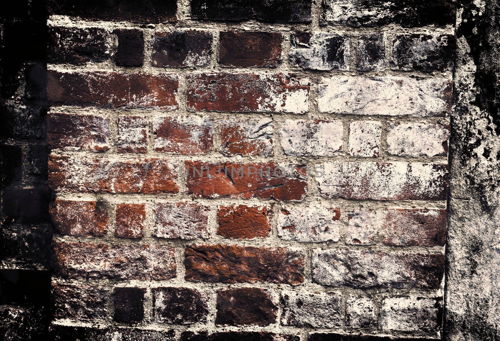 Aged and weathered old brick wall texture in a retro vintage design  by MP_foto71