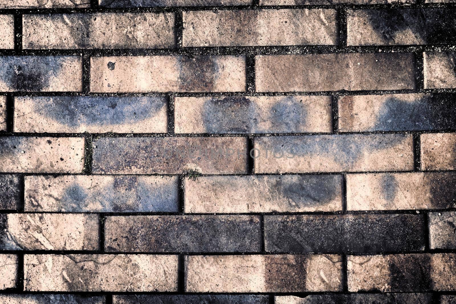 Aged and weathered old brick wall texture in a retro vintage design  by MP_foto71