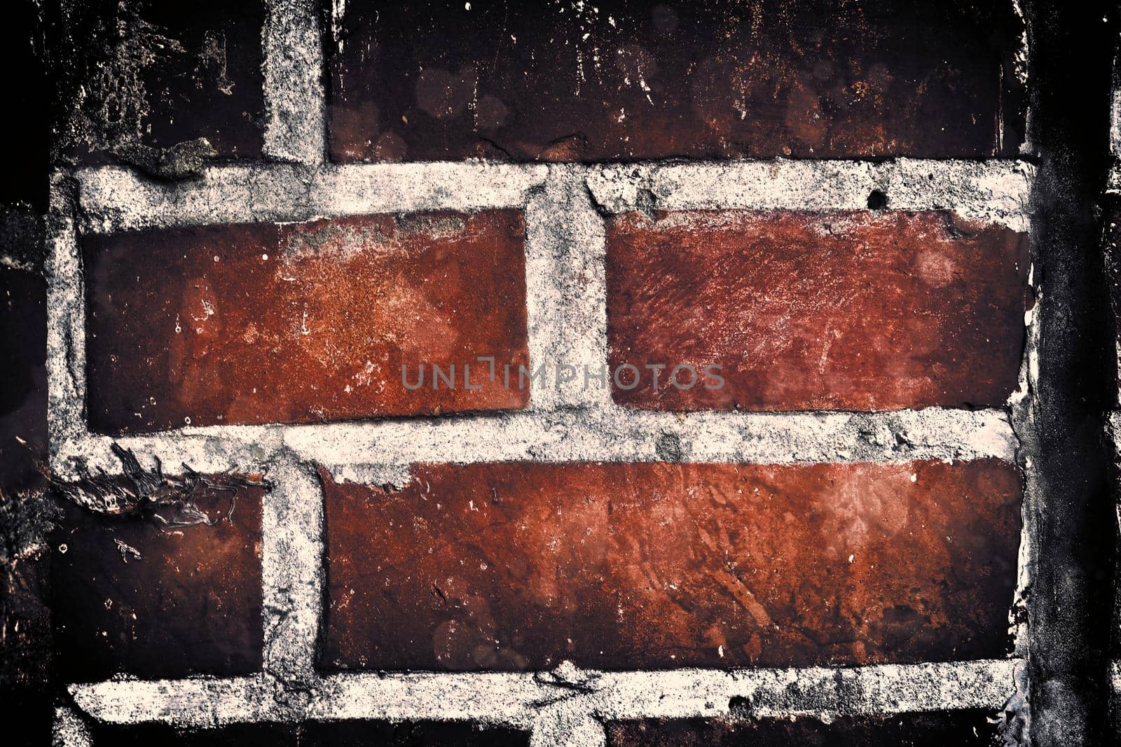 Aged and weathered old brick wall texture in a retro vintage design  by MP_foto71