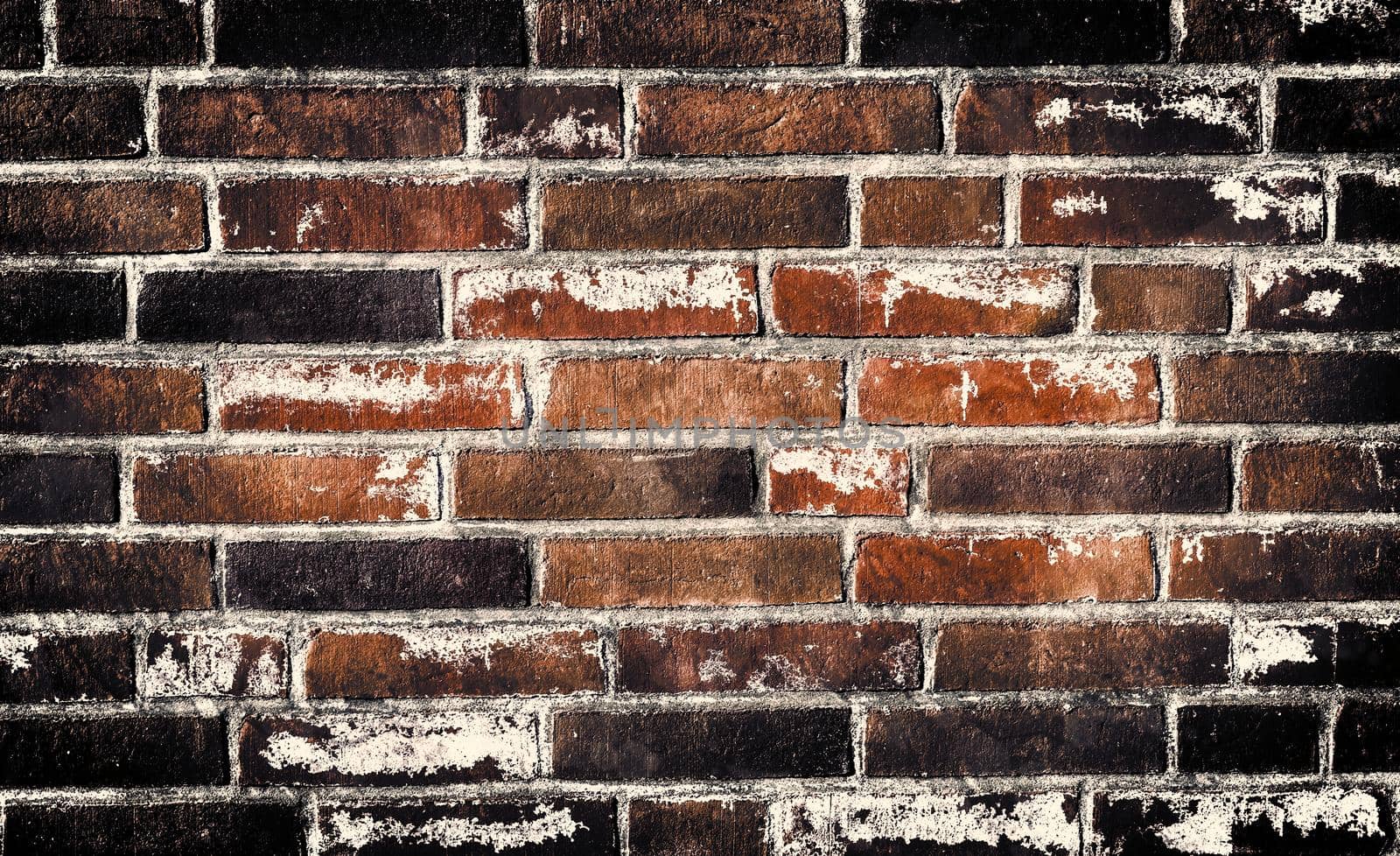 Aged and weathered old brick wall texture in a retro vintage design  by MP_foto71