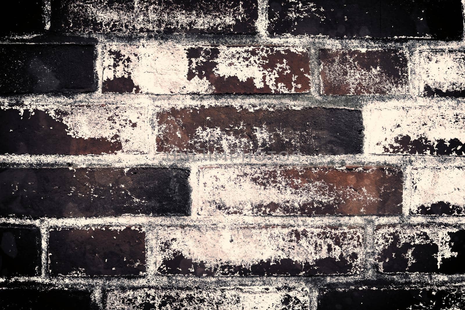 Aged and weathered old brick wall texture in a retro vintage design  by MP_foto71