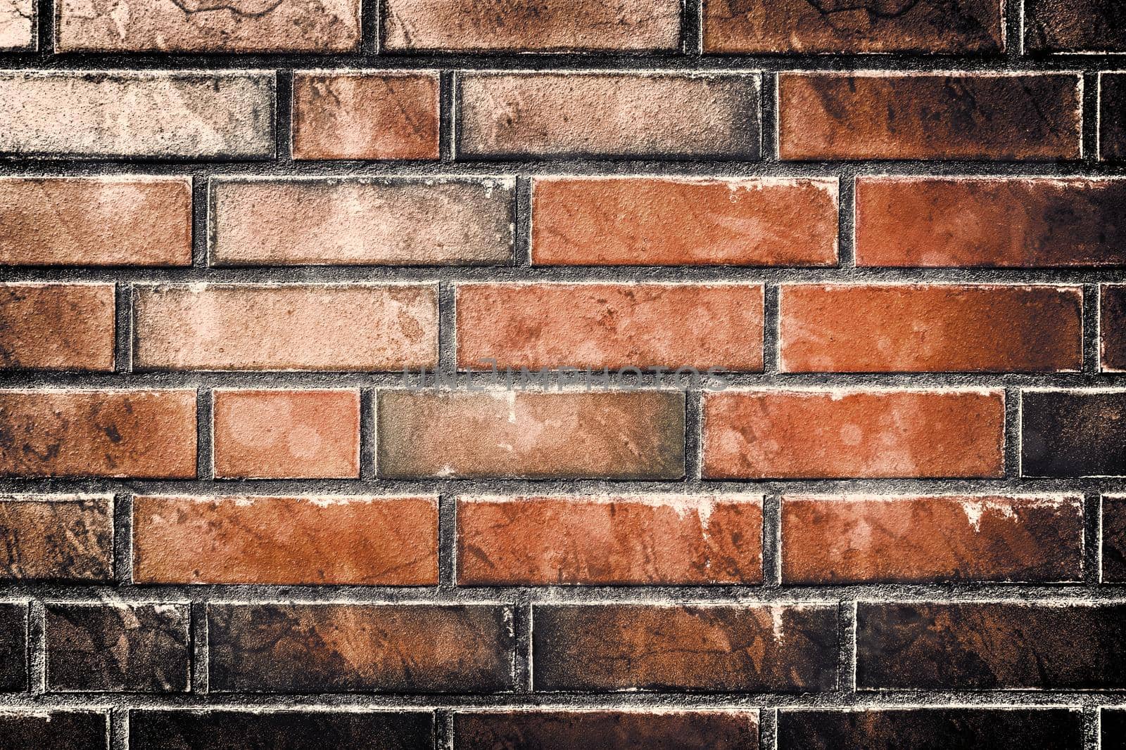 Aged and weathered old brick wall texture in a retro vintage design  by MP_foto71