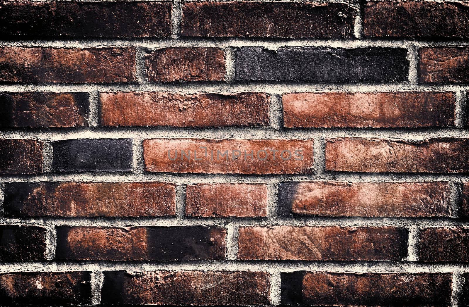 Aged and weathered old brick wall texture in a retro vintage design  by MP_foto71