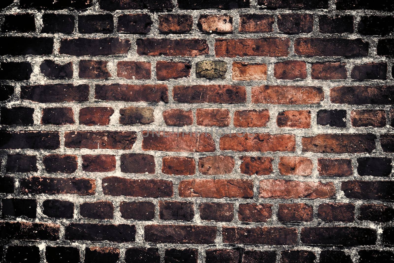 Aged and weathered old brick wall texture in a vintage retro design 