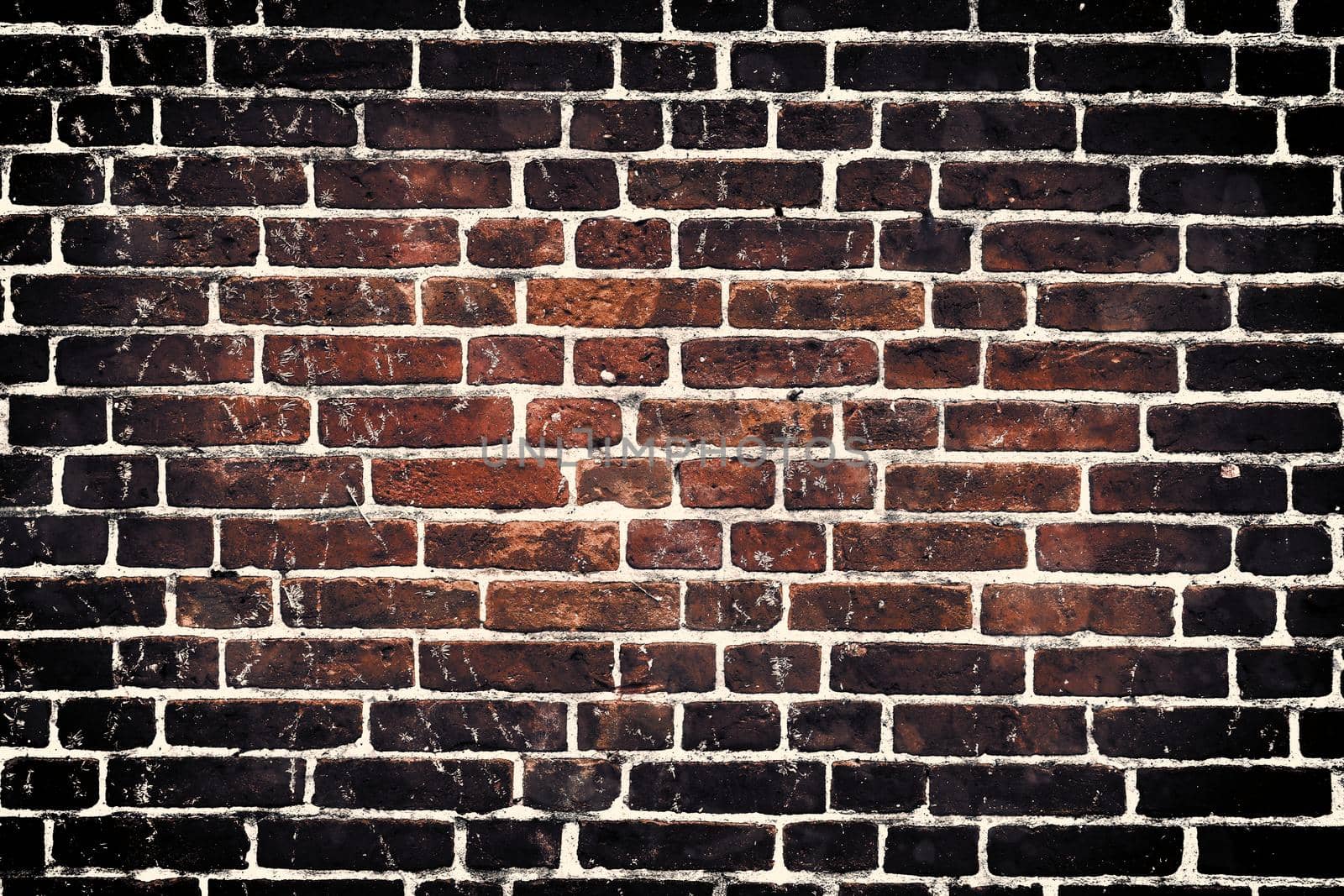 Aged and weathered old brick wall texture in a retro vintage design  by MP_foto71