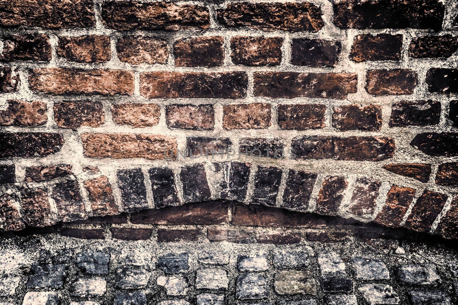 Aged and weathered old brick wall texture in a retro vintage design  by MP_foto71