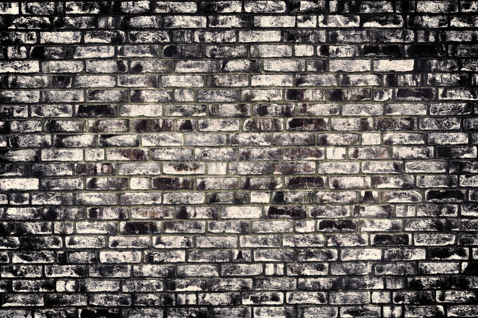 Aged and weathered old brick wall texture in a retro vintage design  by MP_foto71