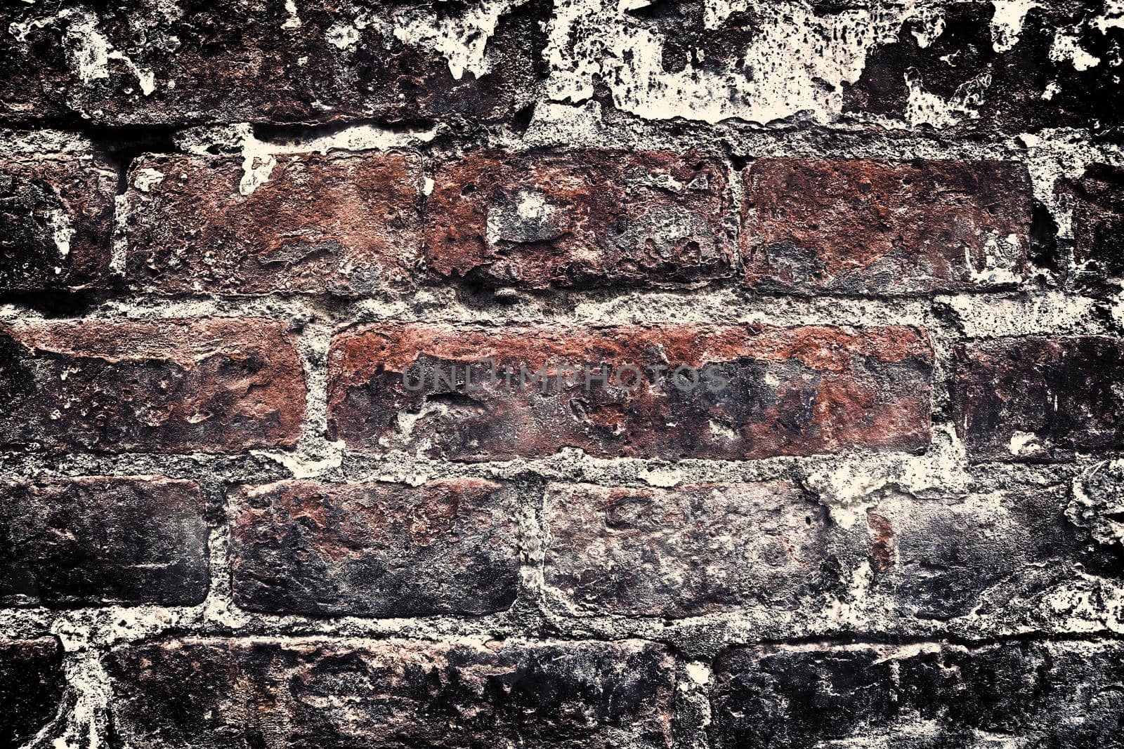 Aged and weathered old brick wall texture in a retro vintage design  by MP_foto71