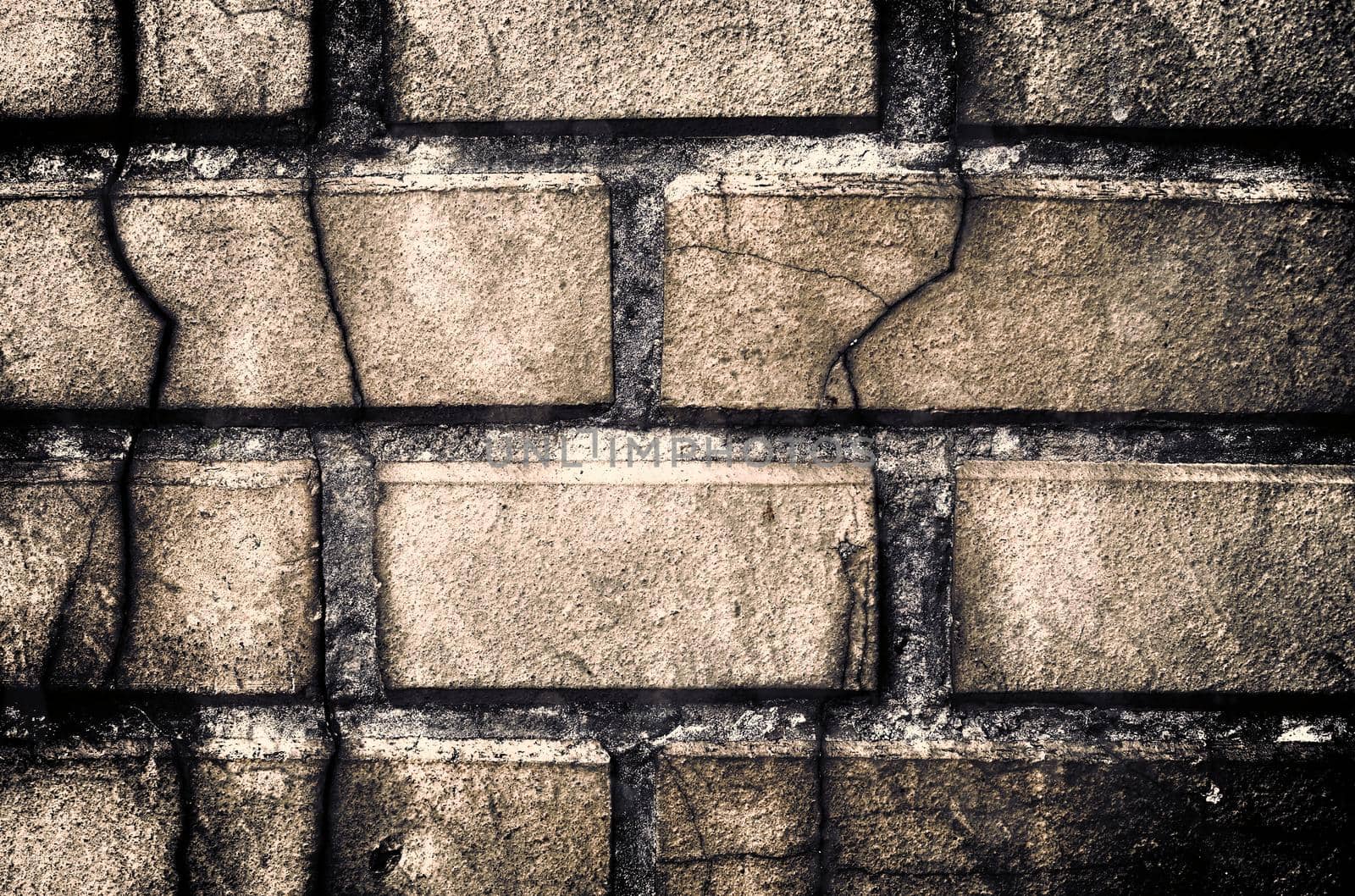 Aged and weathered old brick wall texture in a retro vintage design  by MP_foto71