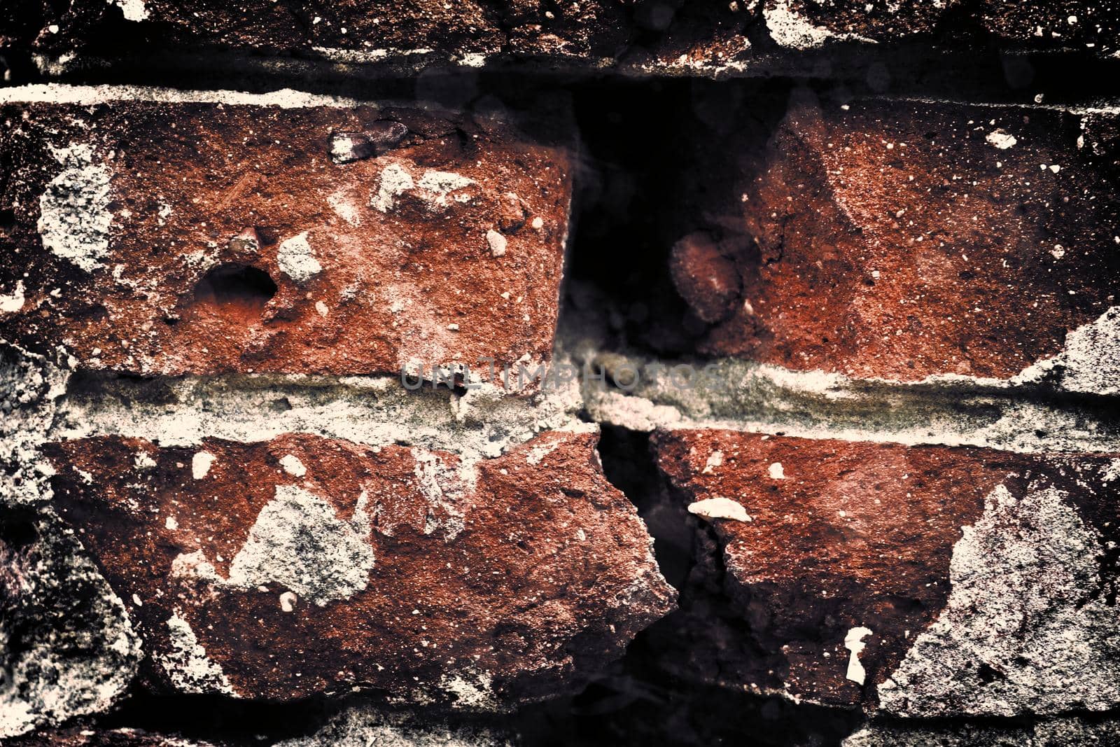 Aged and weathered old brick wall texture in a retro vintage design  by MP_foto71