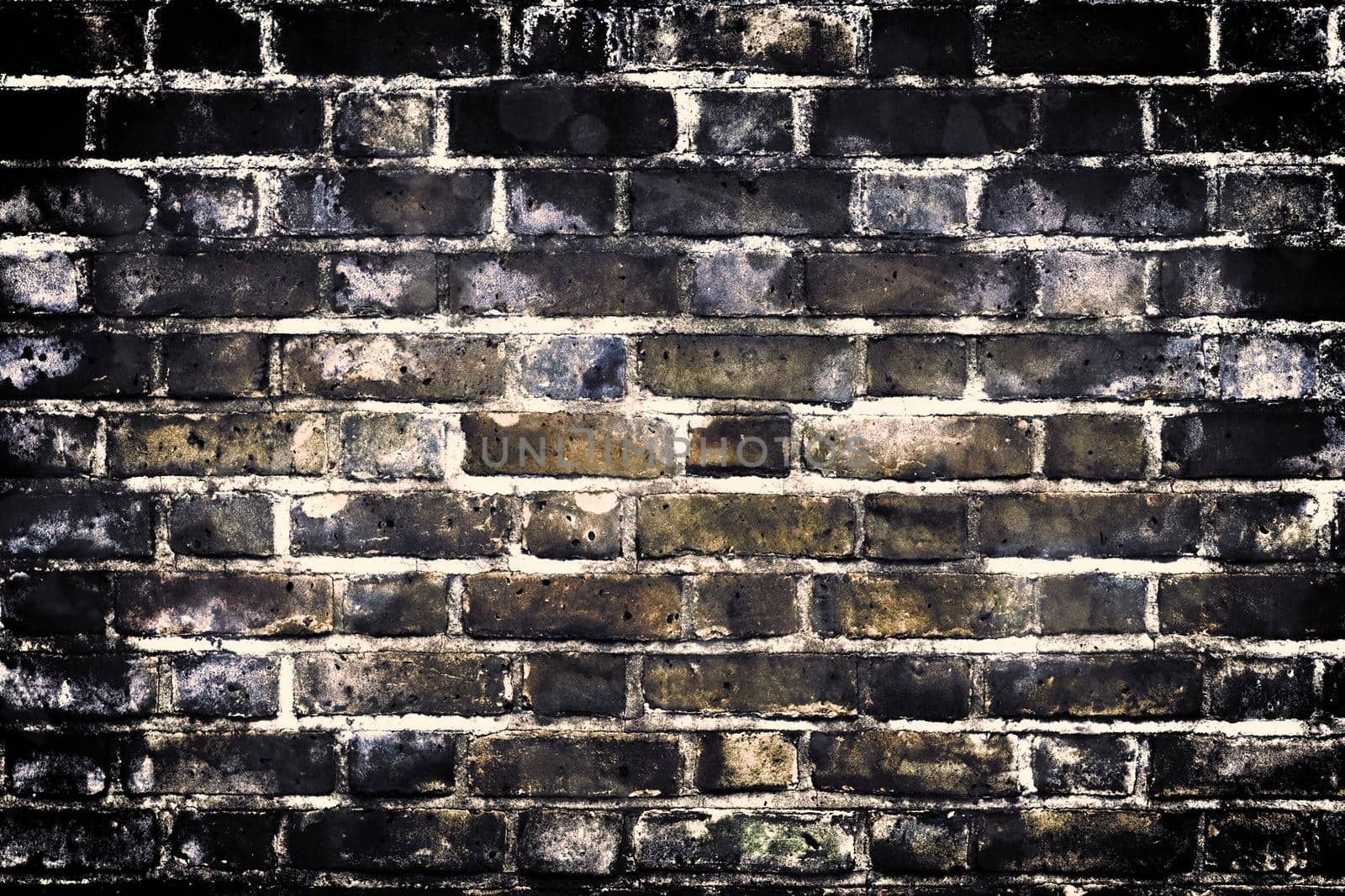 Aged and weathered old brick wall texture in a retro vintage design  by MP_foto71