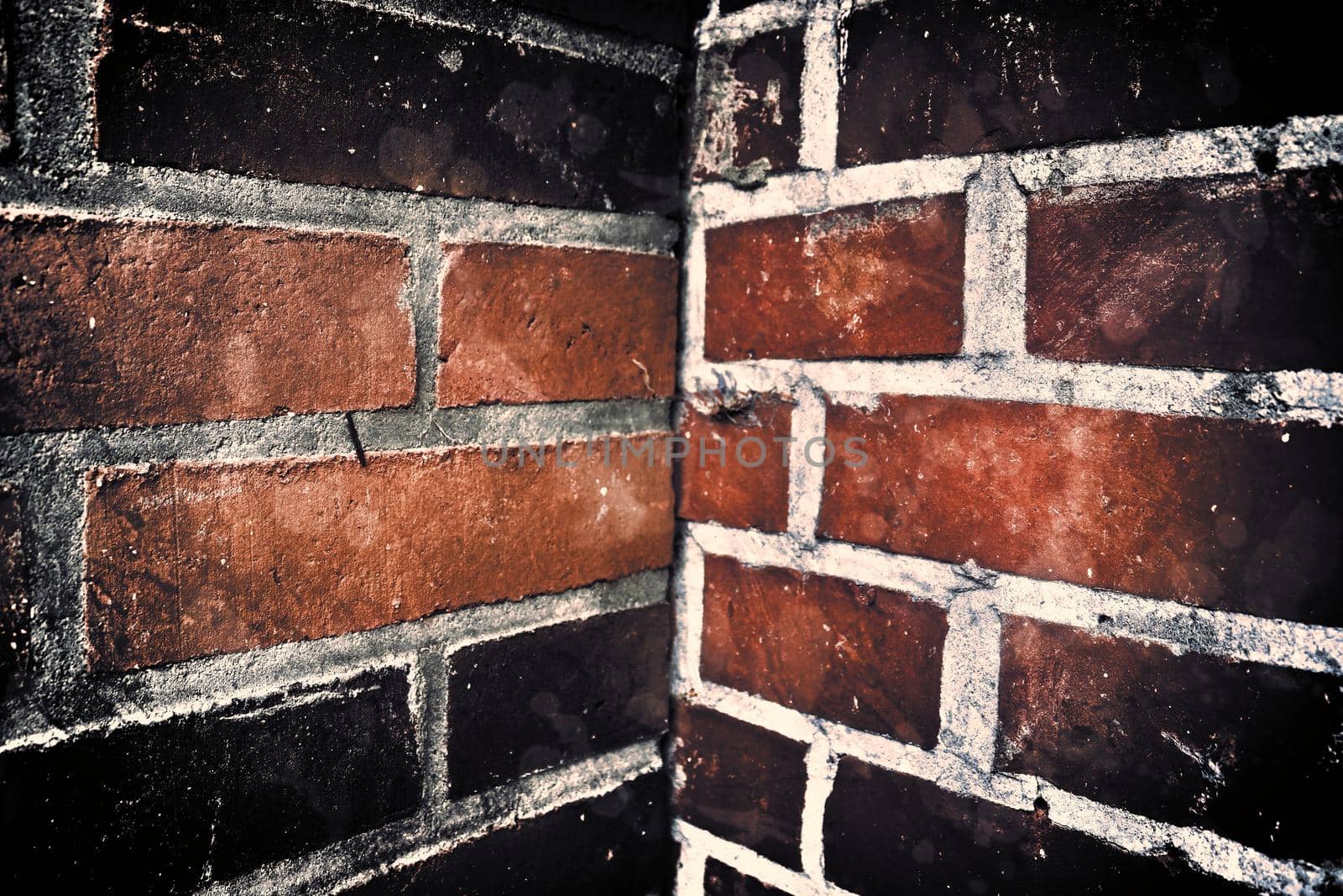 Aged and weathered old brick wall texture in a retro vintage design  by MP_foto71