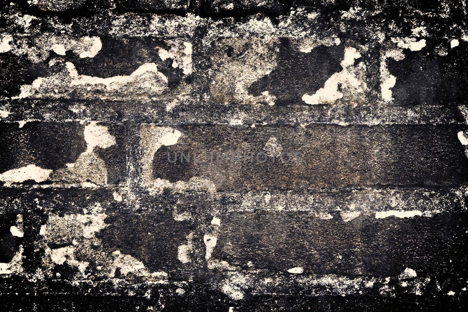 Aged and weathered old brick wall texture in a retro vintage design  by MP_foto71