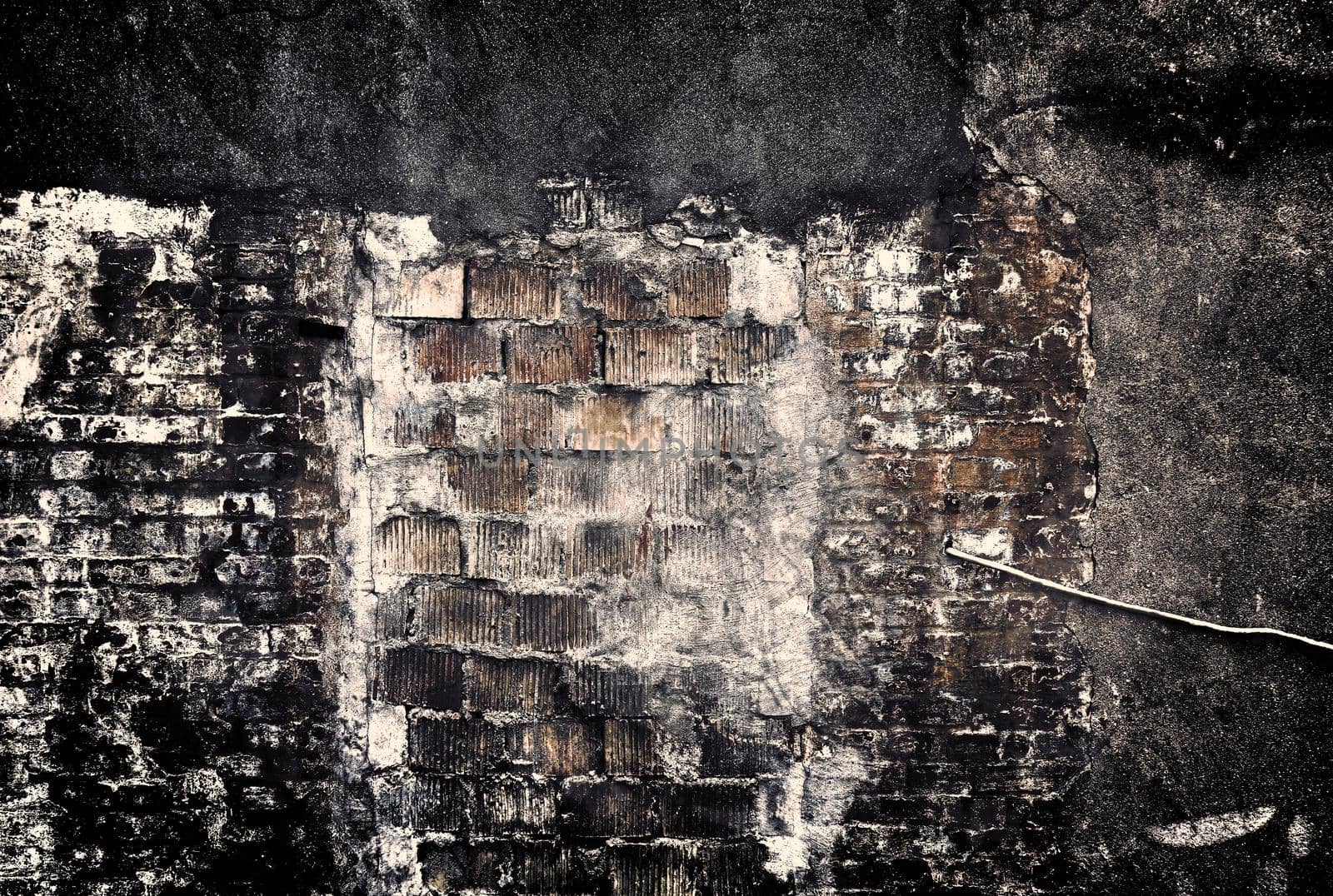 Aged and weathered old brick wall texture in a retro vintage design  by MP_foto71