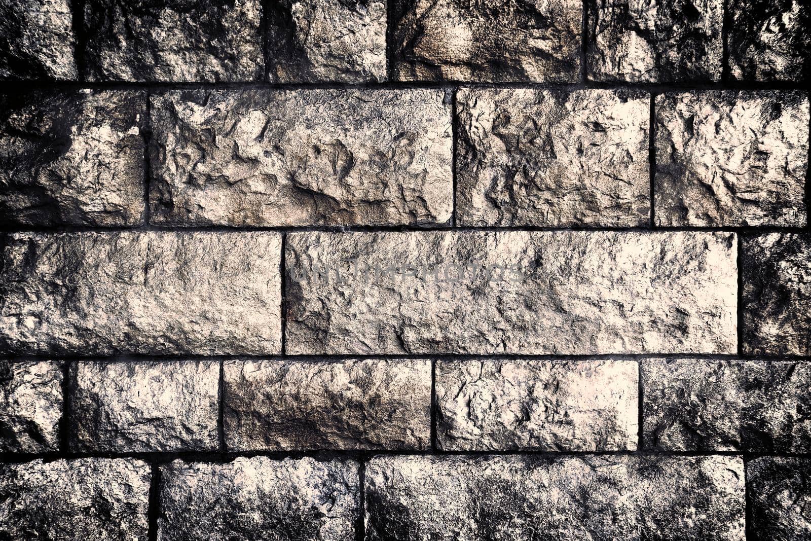 Aged and weathered old brick wall texture in a retro vintage design  by MP_foto71