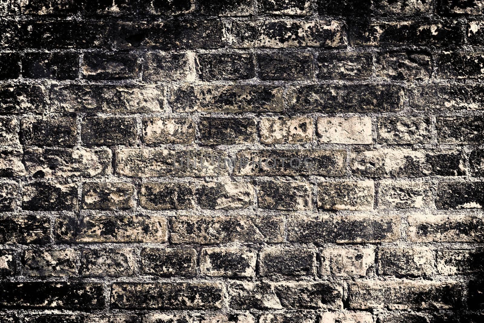 Aged and weathered old brick wall texture in a vintage retro design 