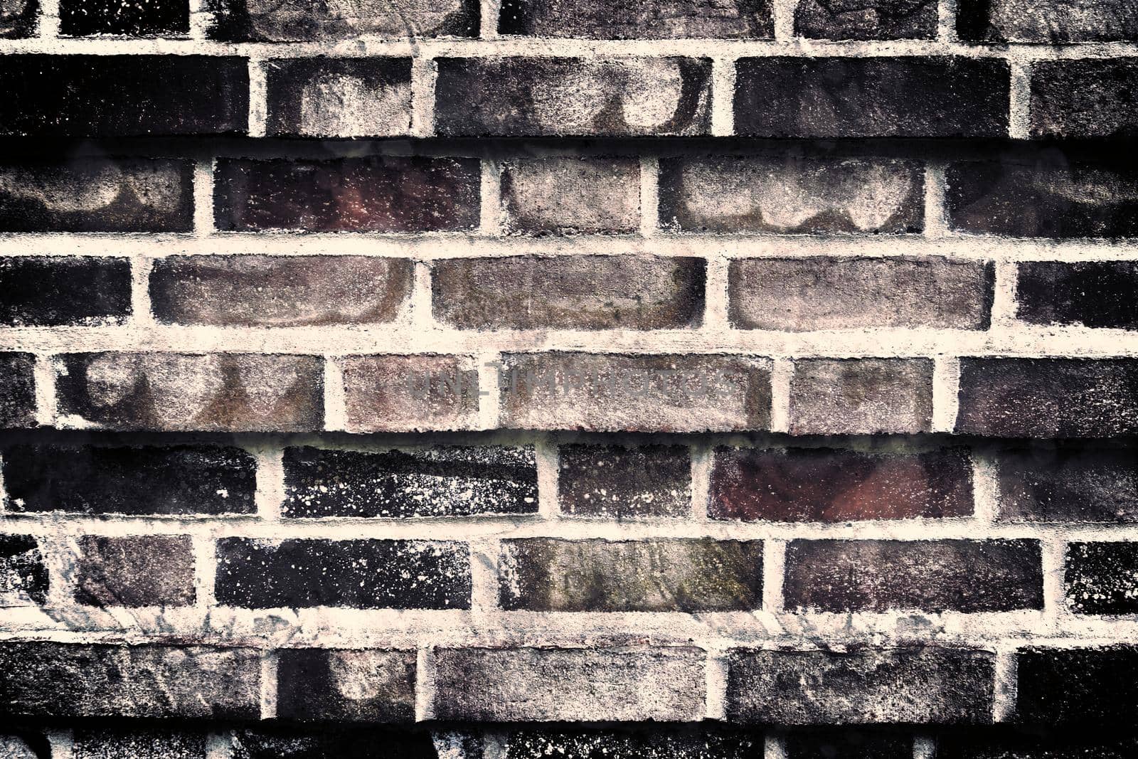 Aged and weathered old brick wall texture in a vintage retro design 