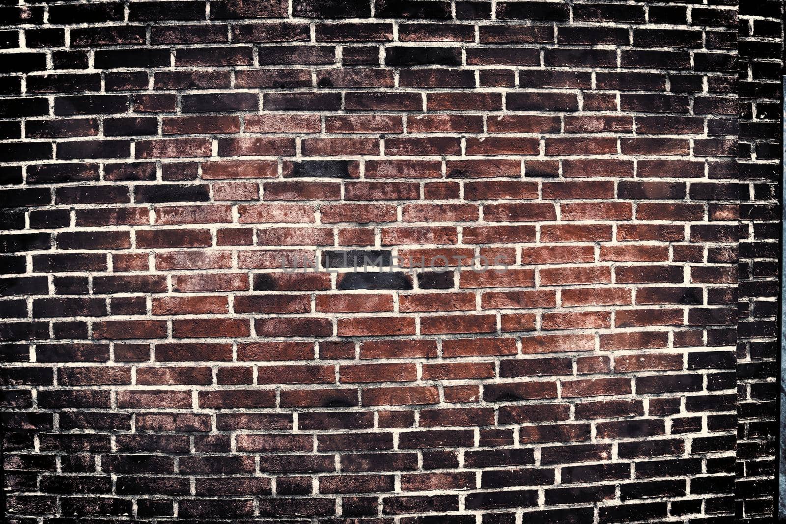 Aged and weathered old brick wall texture in a vintage retro design 