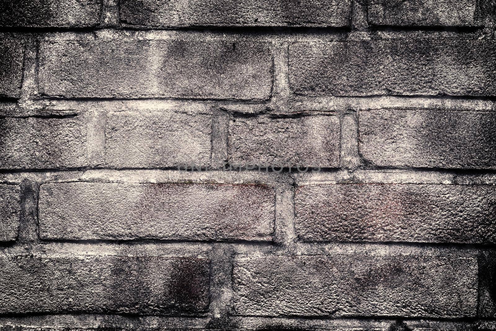 Aged and weathered old brick wall texture in a vintage retro design 