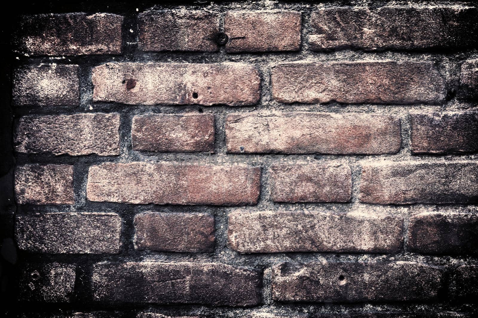 Aged and weathered old brick wall texture in a vintage retro design 