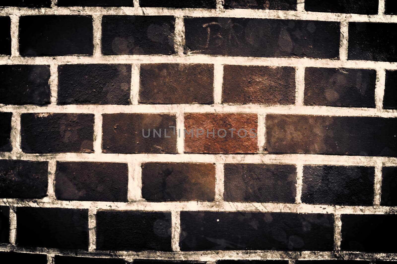 Aged and weathered old brick wall texture in a vintage retro design 