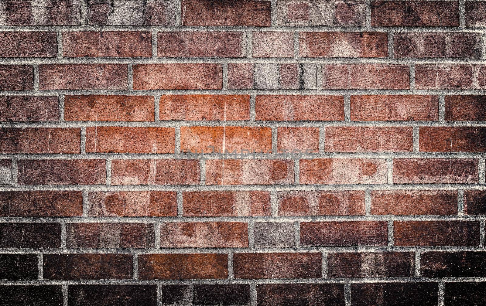 Aged and weathered old brick wall texture in a vintage retro design 