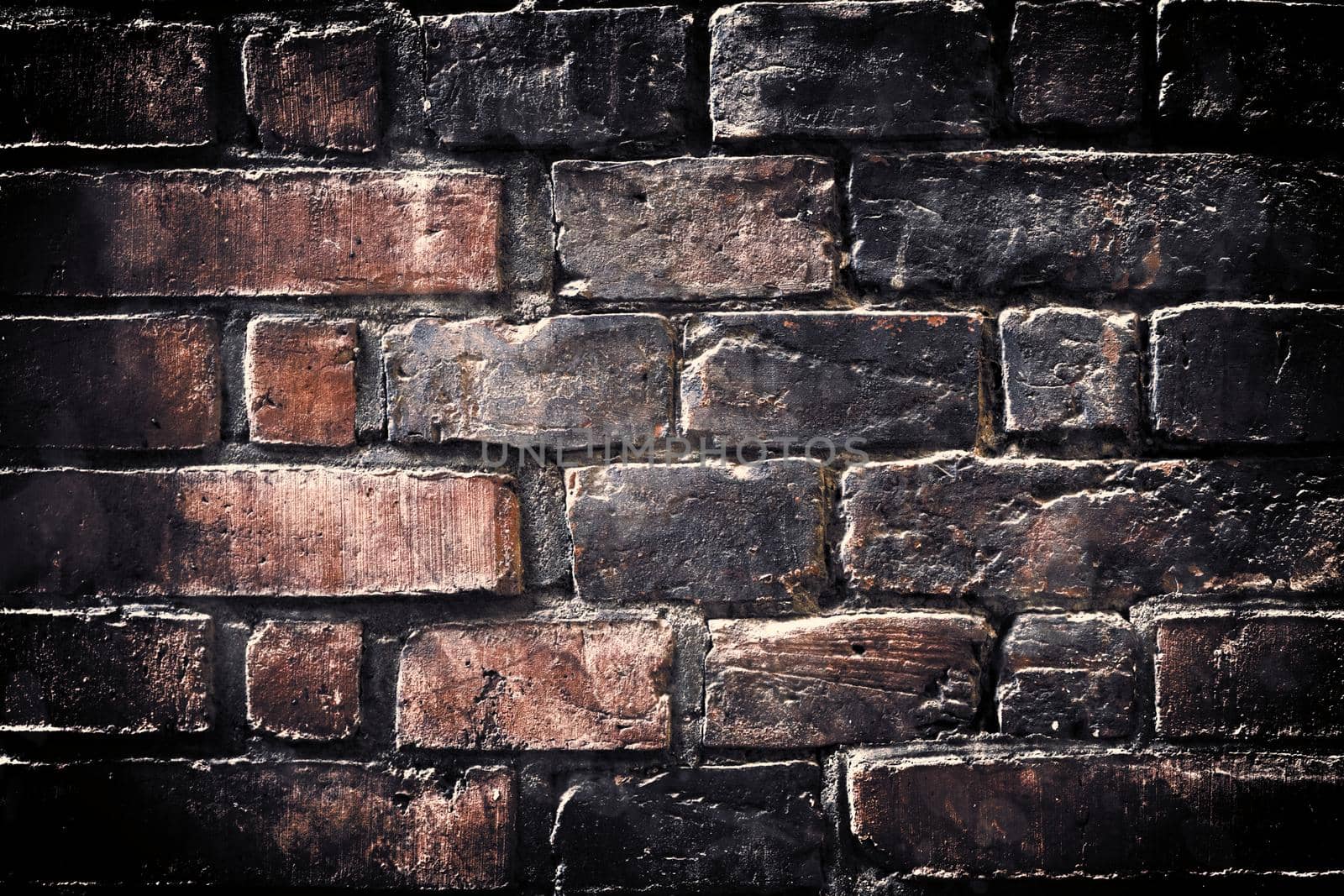 Aged and weathered old brick wall texture in a vintage retro design 