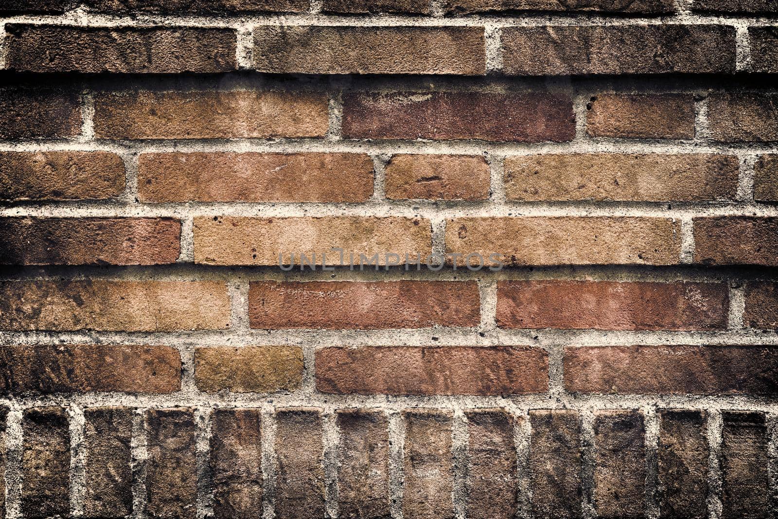 Aged and weathered old brick wall texture in a vintage retro design 