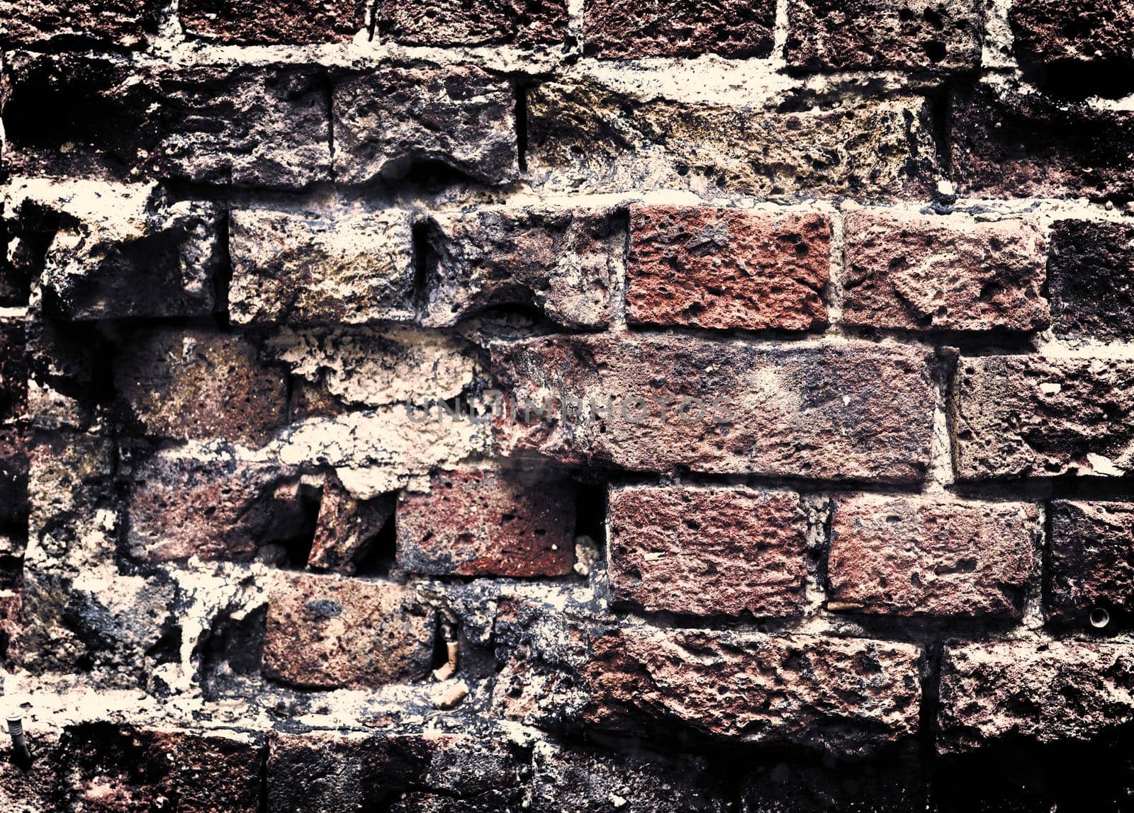 Aged and weathered old brick wall texture in a vintage retro design 