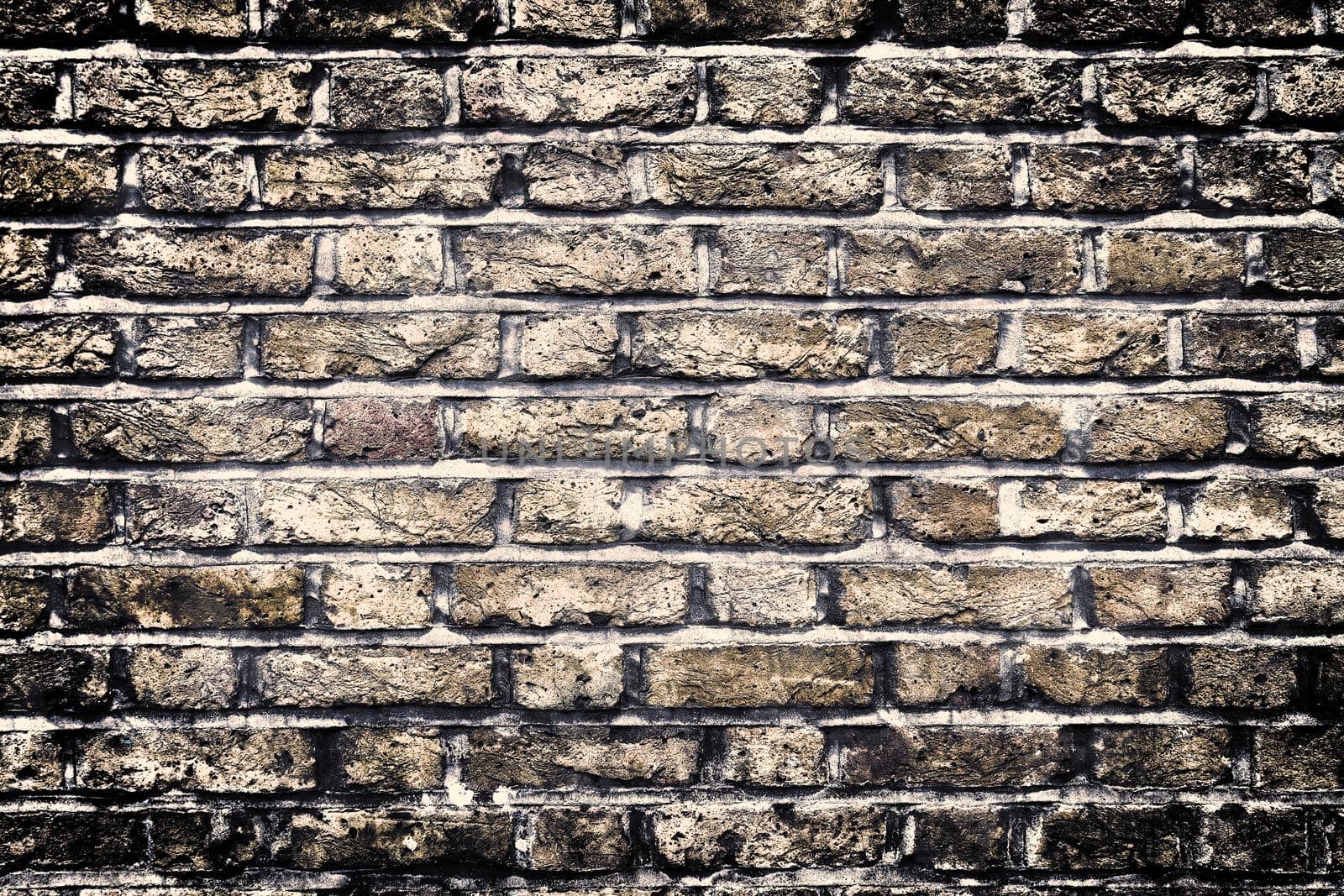 Aged and weathered old brick wall texture in a vintage retro design 